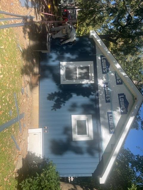 Two-story home with new vinyl board and batten siding installed on all walls in Lakeview, OH